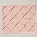 Deep Diamond Mat in pale pink: a hand-woven cotton bath mat with a deep knotted diamond lattice standing proud of the woven ground