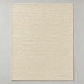 Flatweave Rug in natural oatmeal: a large undyed flat-woven cotton rug with a fine horizontal rib