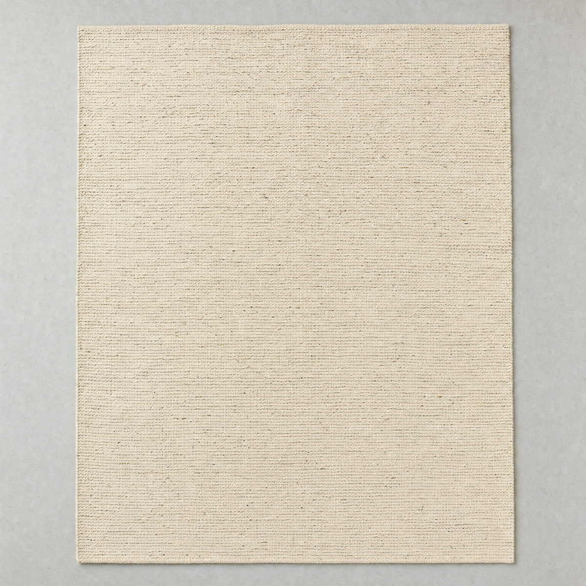Flatweave Rug in natural oatmeal: a large undyed flat-woven cotton rug with a fine horizontal rib