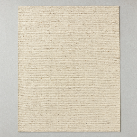 Flatweave Rug in natural oatmeal: a large undyed flat-woven cotton rug with a fine horizontal rib